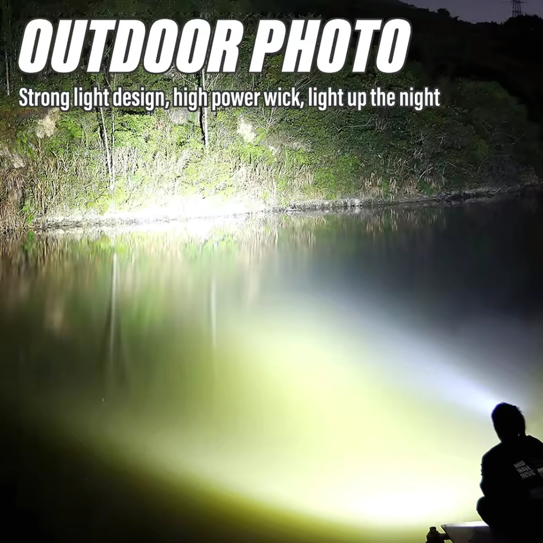 Person using a flashlight to light up a dark forest lake at night.