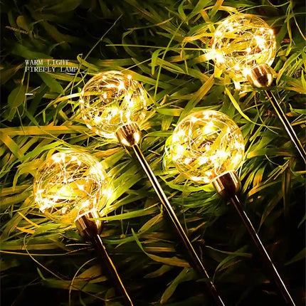 Decorative transparent solar ball light with elegant warm white LED glow.