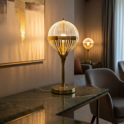 Close-up view of Futurkart gold acrylic rechargeable LED table lamp.