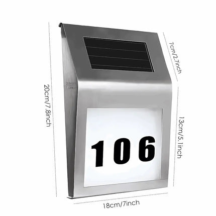 Illuminated solar address plaque for outdoor wall.