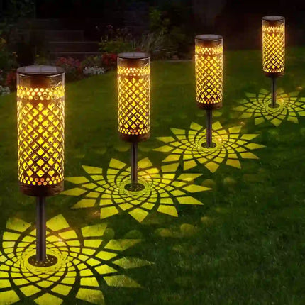 Iron art solar ground light with elegant hollow design.
