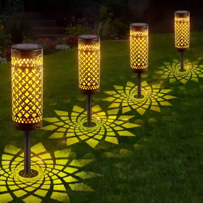 Iron art solar ground light with elegant hollow design.