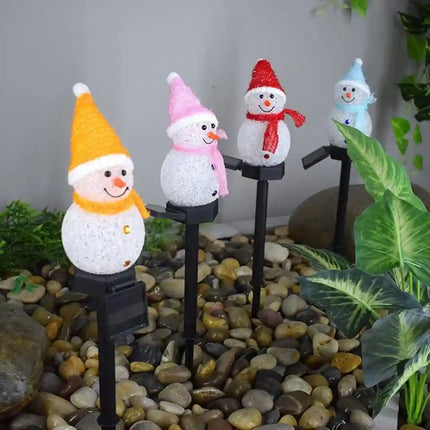 Outdoor solar snowman LED light for Christmas garden decor.