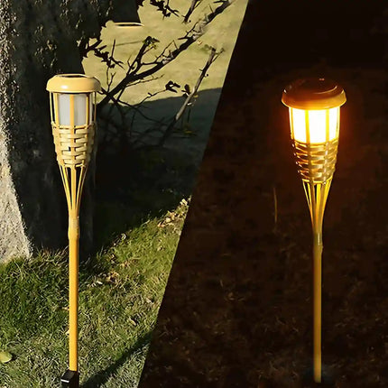 Solar bamboo torch pathway light with warm amber flame.