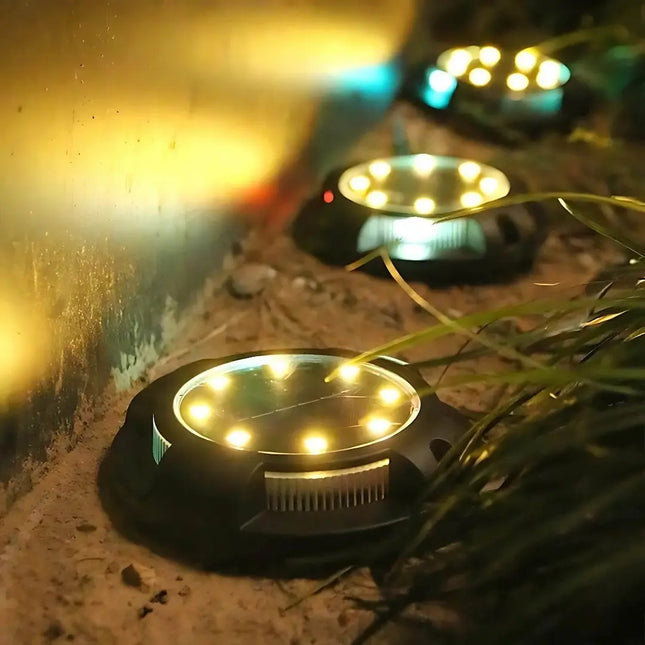 Solar buried ground light for outdoor pathways, gardens, and landscape lighting.