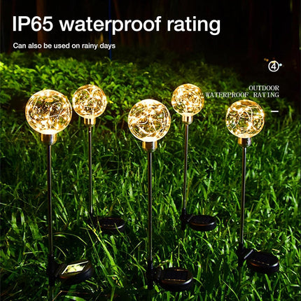 Waterproof solar garden ball light for outdoor landscaping and pathway lighting.