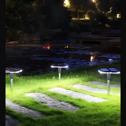 Solar garden lamp with ground spike for easy outdoor installation.