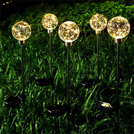 Solar globe pathway light for outdoor gardens, walkways, and landscape decoration.