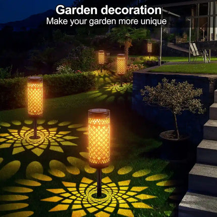 Iron art solar ground insertion light for gardens and pathways.