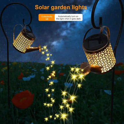 Solar kettle lantern garden light with warm white glow.