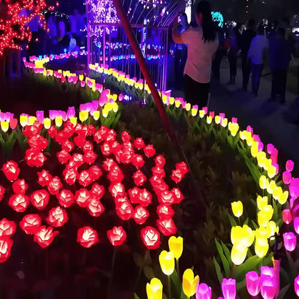 White tulip solar garden light with realistic flower design for lawns and pathways.